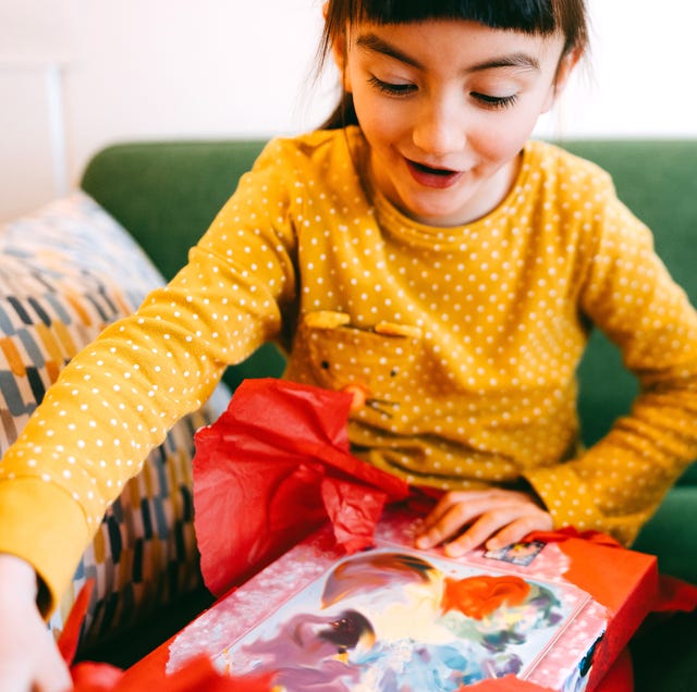 7 year old girl opening up gift 7 year old girl opening up gift